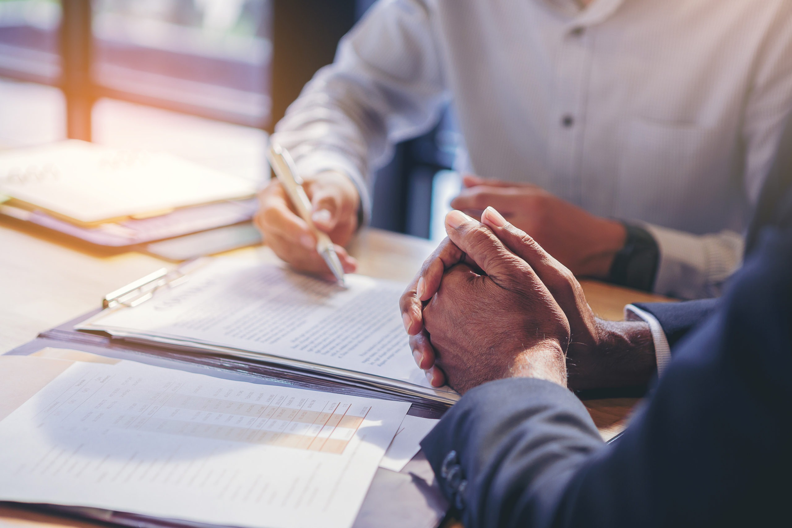 demand letters for breach of contract concept.businessman reading documents at meeting, business partner considering contract terms before signing checking legal contract law conditions